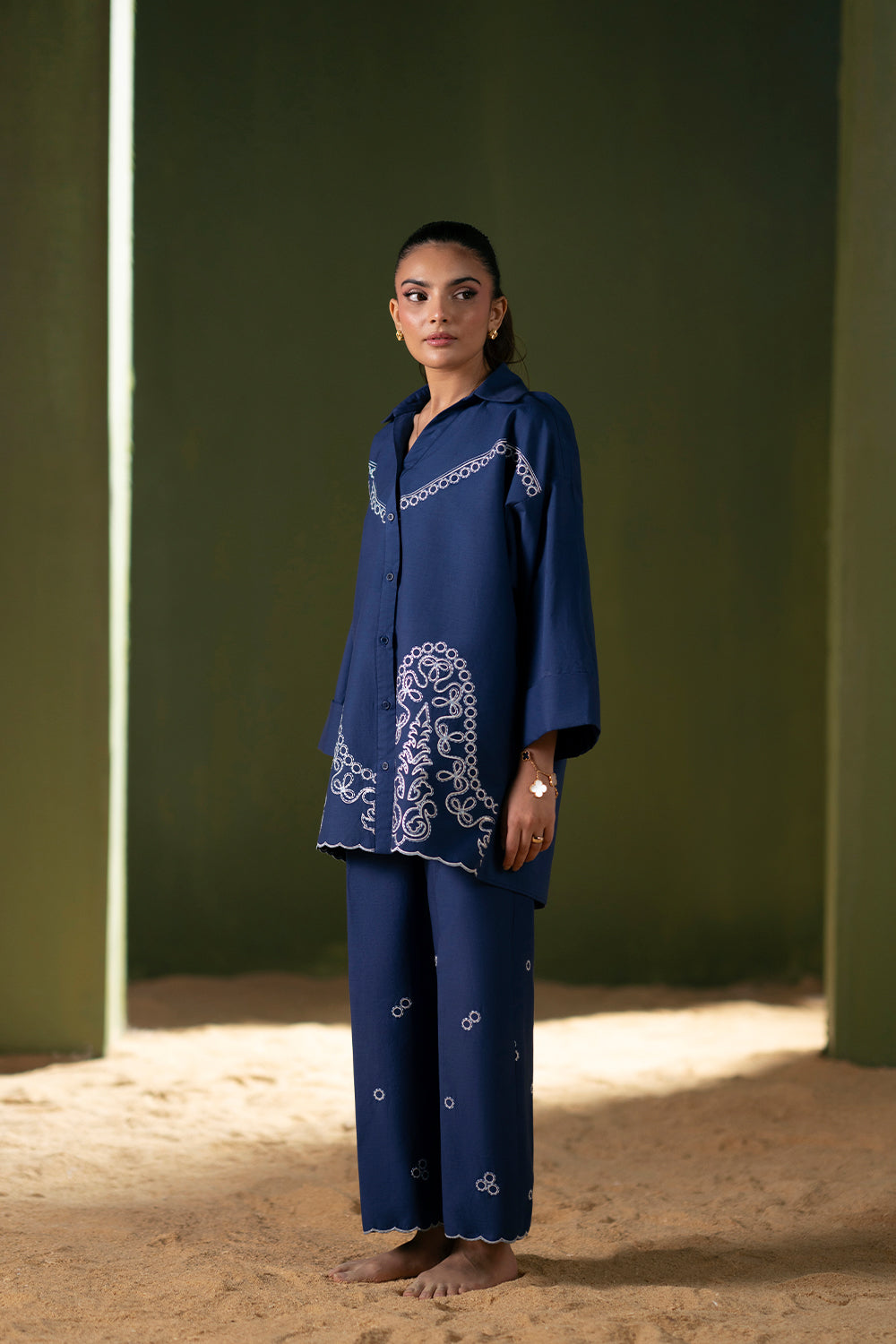 Model wearing navy blue embroidered outfit from Saira Rizwan Joolie | BLUE-JBP25-03, Pakistani luxury pret available online in UK.