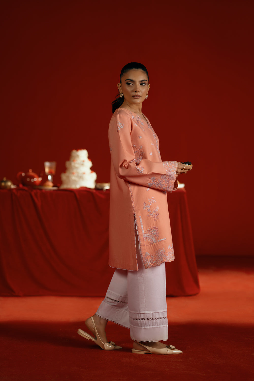 Model wearing peach embroidered outfit from Saira Rizwan Joolie | PEACH - JBP25-05, elegant Pakistani luxury pret available online in UK.