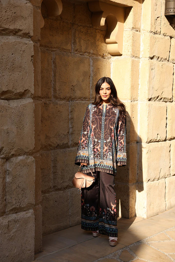 Model wearing black co-ord set with multicolour floral and geometric print from Saira Rizwan, Pakistani Luxury pret, Pakistani clothes online in UK.