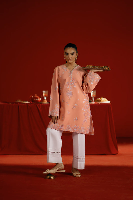 Model wearing peach embroidered outfit from Saira Rizwan Joolie | PEACH - JBP25-05, elegant Pakistani luxury pret available online in UK.