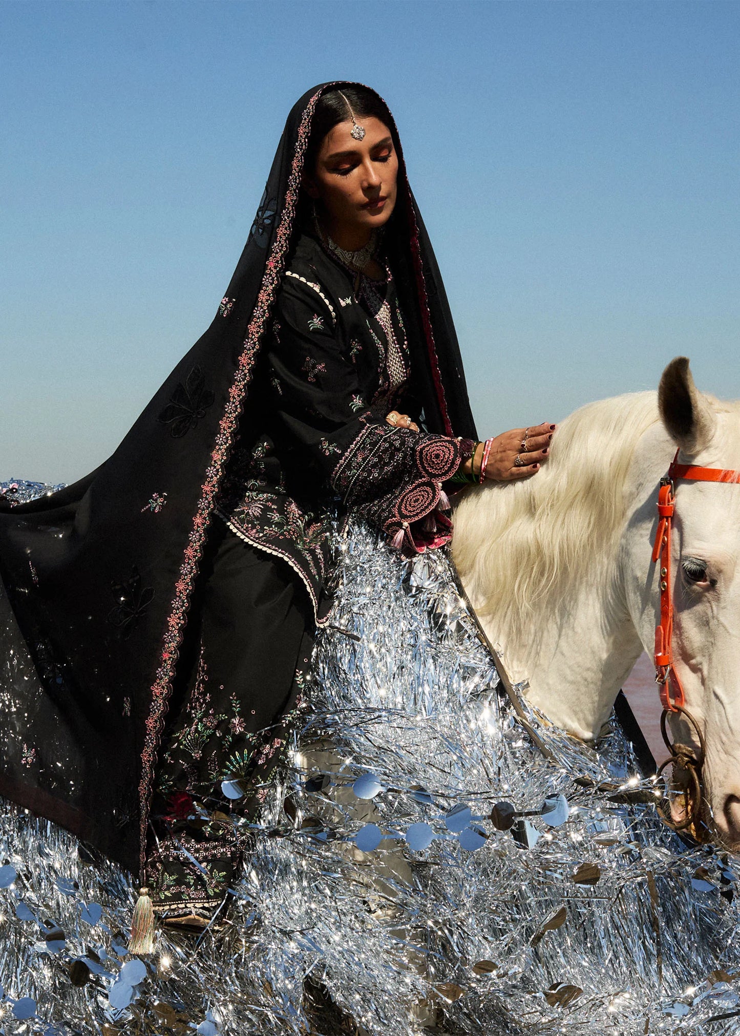 Model wearing black dress Siyah by Hussain Rehar, Pakistani luxury pret online in UK for festive wear and Eid.