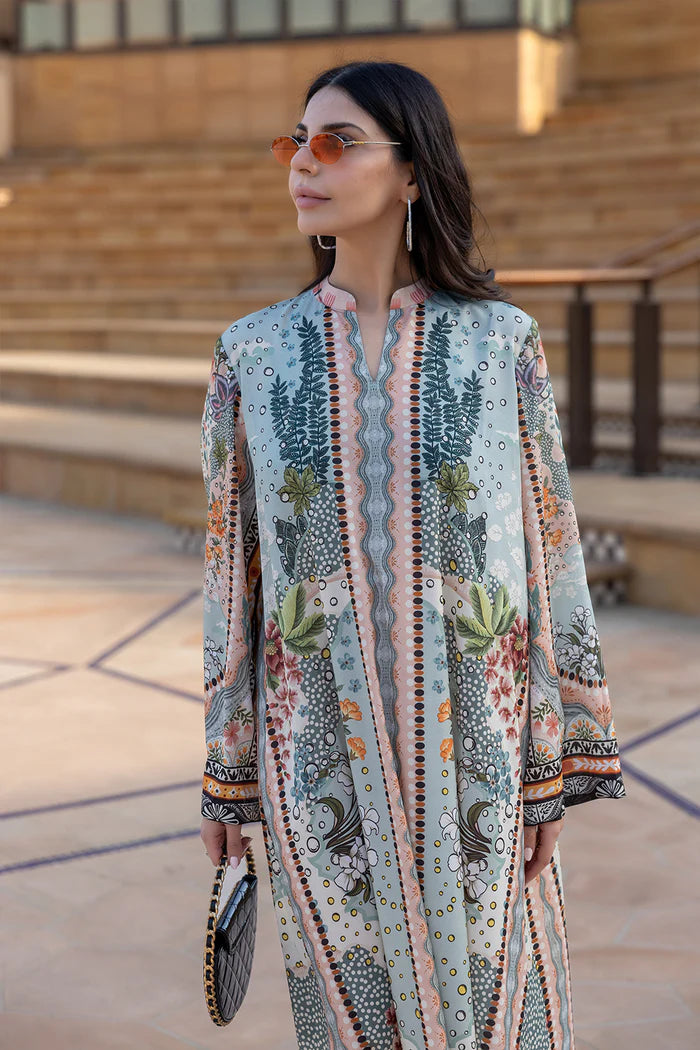 Model wearing multicolour printed long kaftan-style dress with flared sleeves from Saira Rizwan, Pakistani luxury pret, Pakistani clothes online in UK.