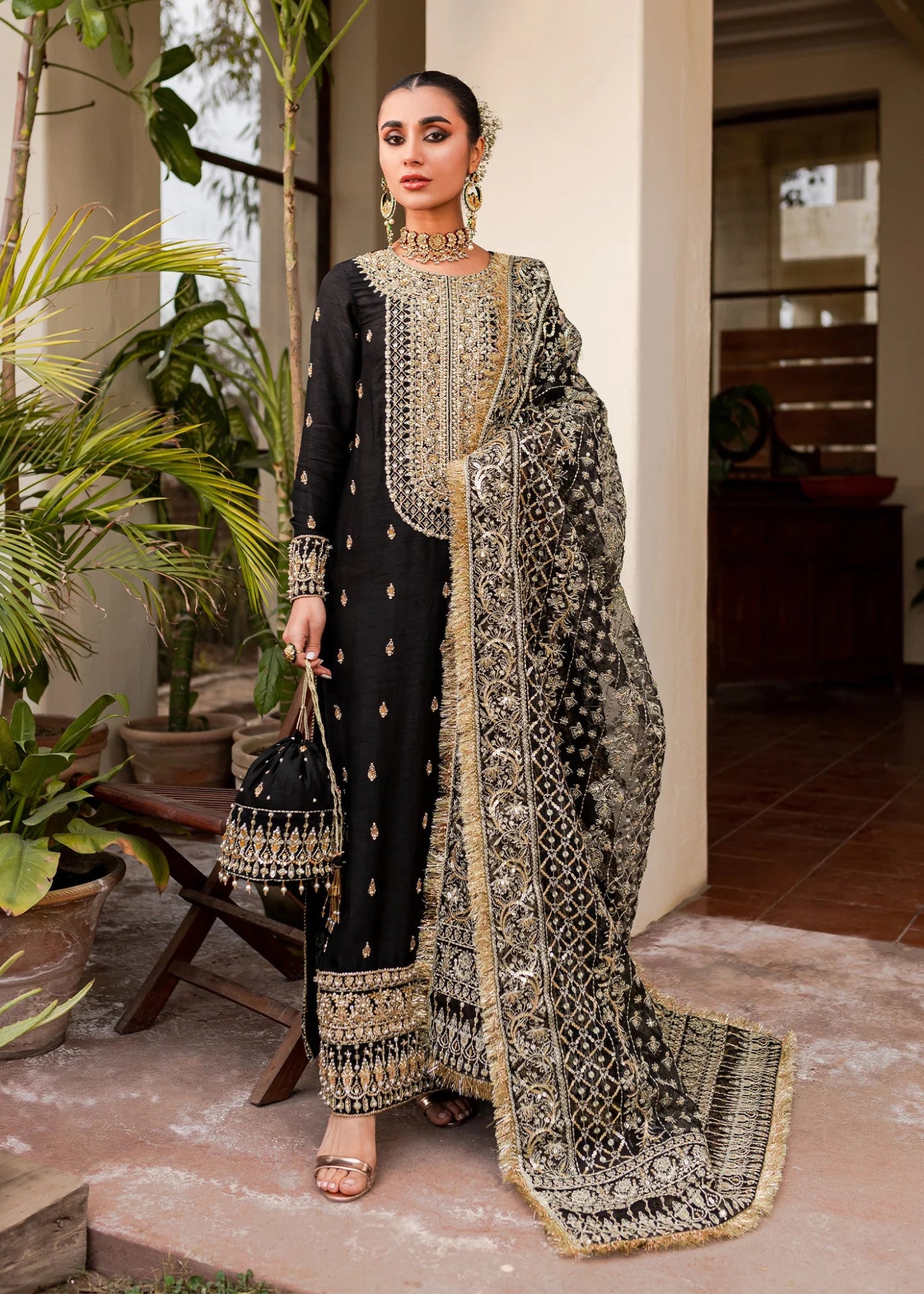 Kanwal Malik UK Chiragh attire, opulent black gold Pakistani clothes UK.