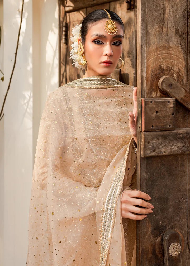 Model flaunting Kanwal Malik Afreen Luxury Pret '23 Shama dress, epitomizing Pakistani wedding clothes online in the UK.