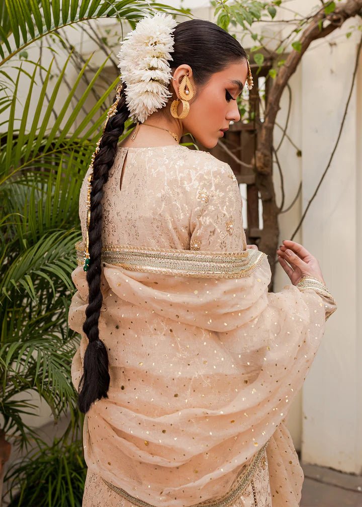 Model flaunting Kanwal Malik Afreen Luxury Pret '23 Shama dress, epitomizing Pakistani wedding clothes online in the UK.