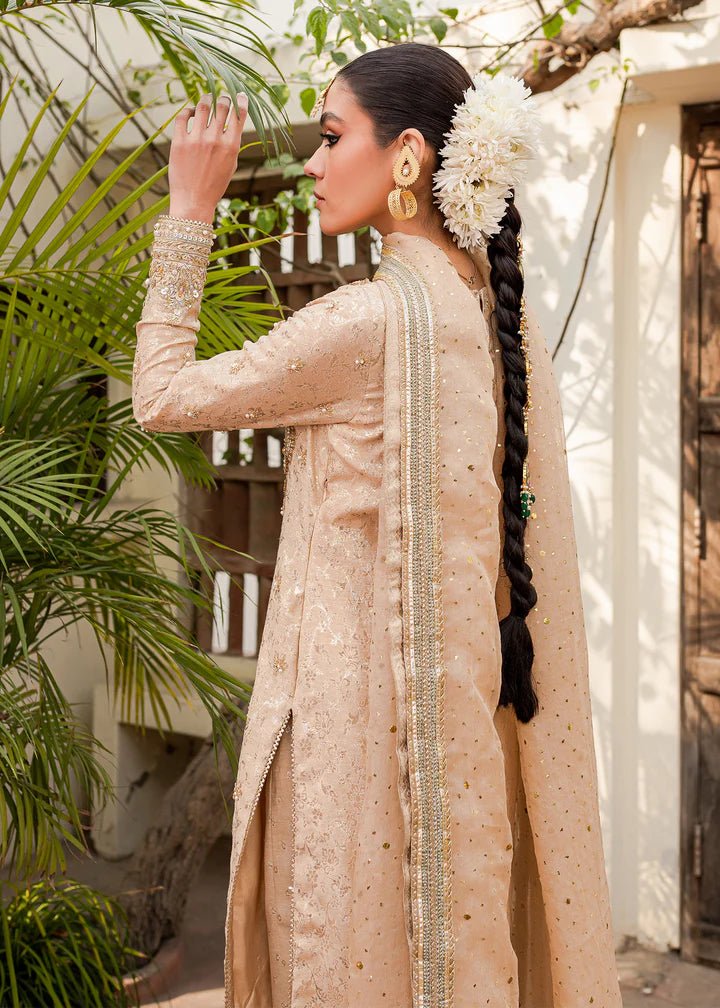 Model flaunting Kanwal Malik Afreen Luxury Pret '23 Shama dress, epitomizing Pakistani wedding clothes online in the UK.