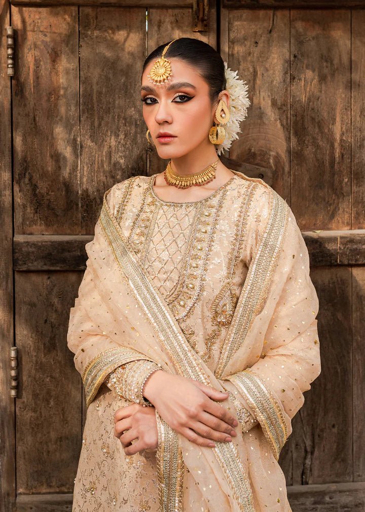 Model flaunting Kanwal Malik Afreen Luxury Pret '23 Shama dress, epitomizing Pakistani wedding clothes online in the UK.