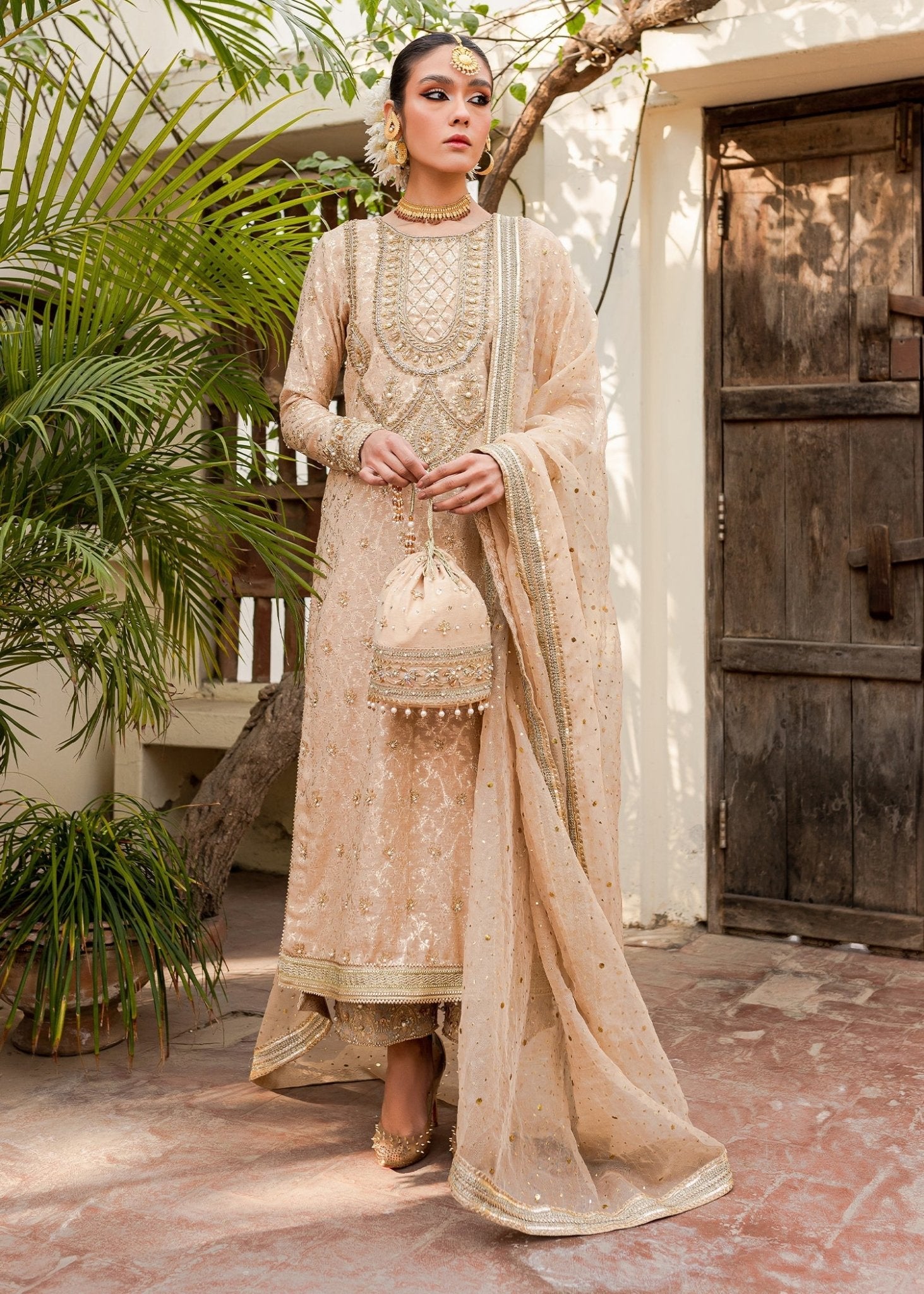 Model flaunting Kanwal Malik Afreen Luxury Pret '23 Shama dress, epitomizing Pakistani wedding clothes online in the UK.