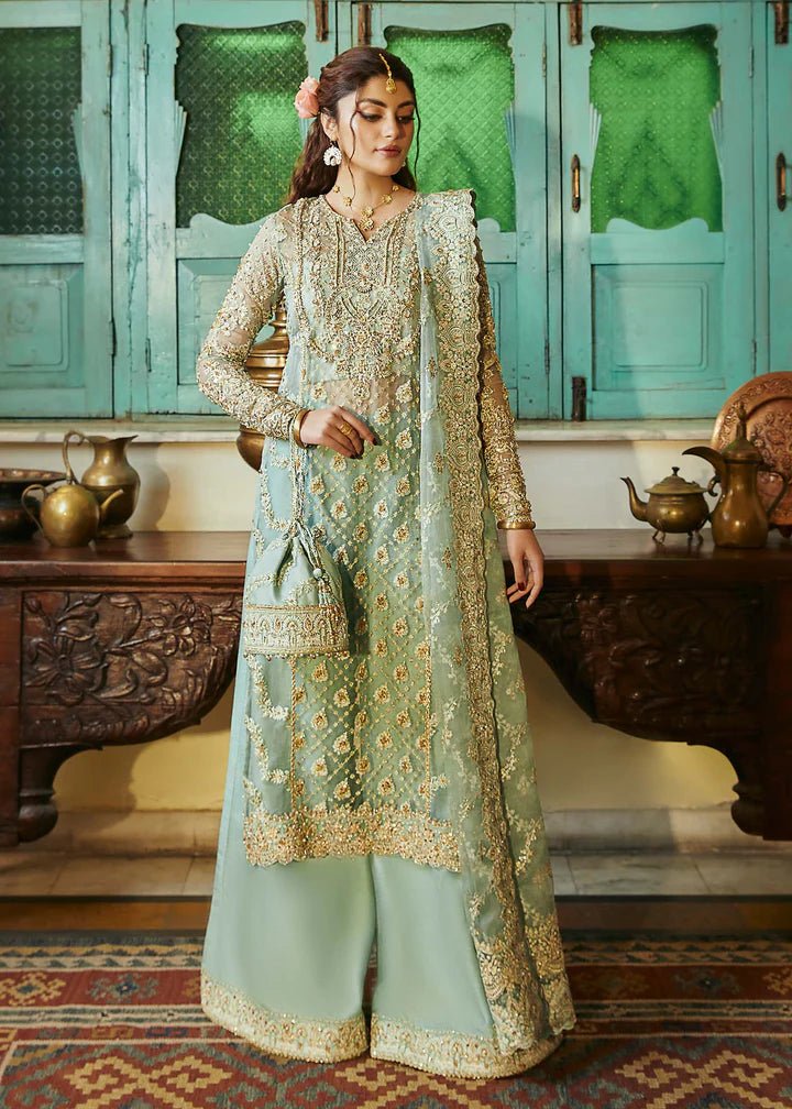 Model wearing light green Meera dress from Kanwal Malik, Afsheen Luxury Pret 2024 collection. Pakistani wedding clothes online in UK, elegant fashion.