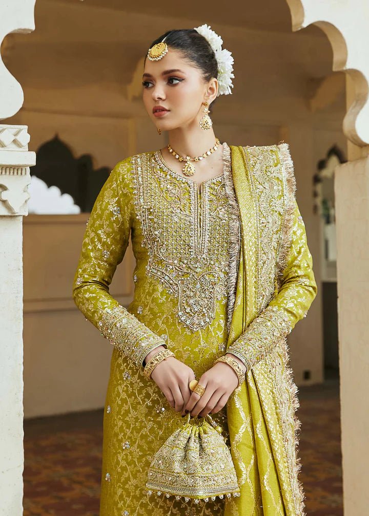 Model wearing mustard yellow Mushq dress from Kanwal Malik, Afsheen Luxury Pret 2024 collection. Pakistani clothes online in UK, wedding clothes.