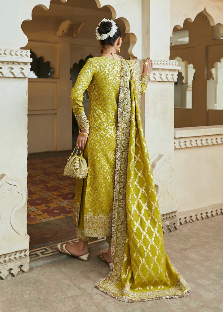 Model wearing mustard yellow Mushq dress from Kanwal Malik, Afsheen Luxury Pret 2024 collection. Pakistani clothes online in UK, wedding clothes.