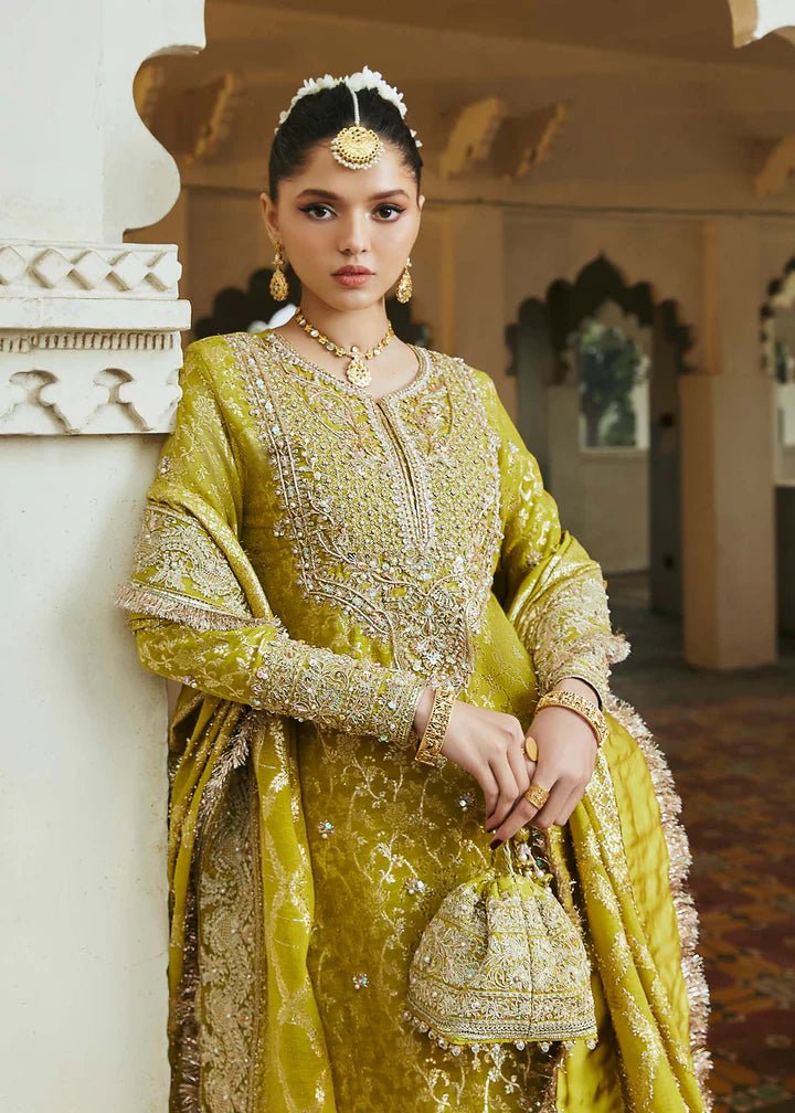 Model wearing mustard yellow Mushq dress from Kanwal Malik, Afsheen Luxury Pret 2024 collection. Pakistani clothes online in UK, wedding clothes.