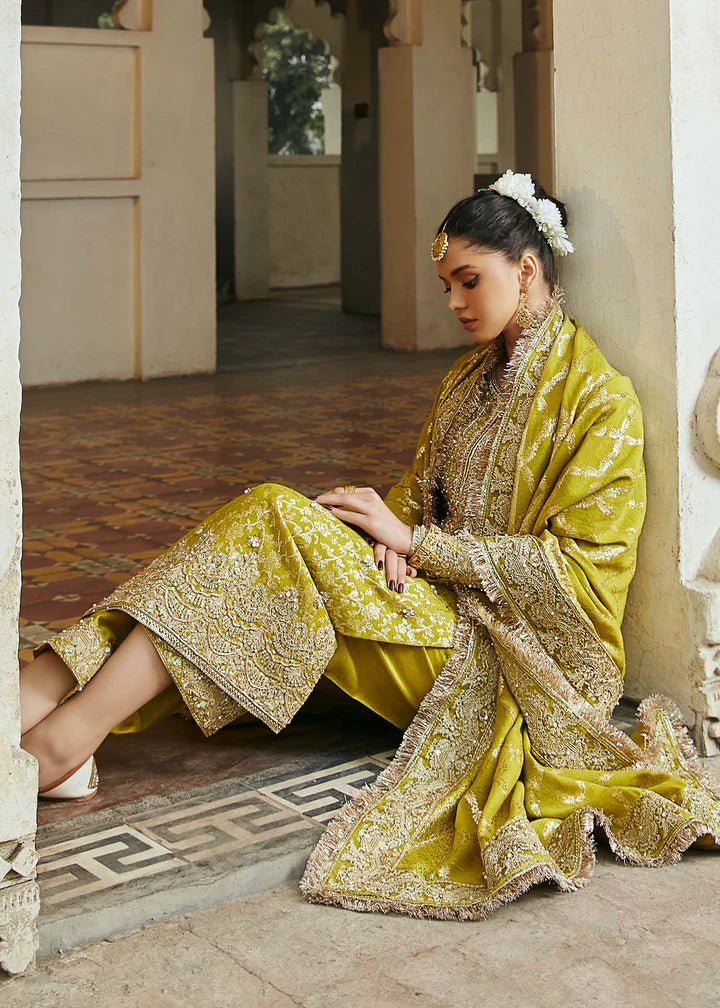 Model wearing mustard yellow Mushq dress from Kanwal Malik, Afsheen Luxury Pret 2024 collection. Pakistani clothes online in UK, wedding clothes.