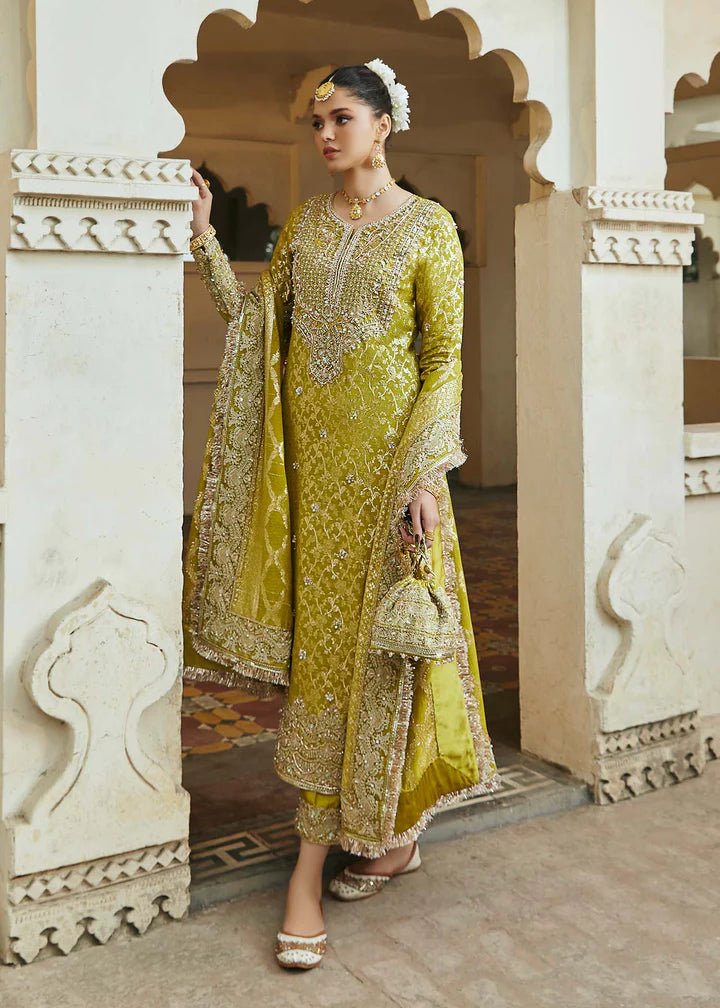 Model wearing mustard yellow Mushq dress from Kanwal Malik, Afsheen Luxury Pret 2024 collection. Pakistani clothes online in UK, wedding clothes.