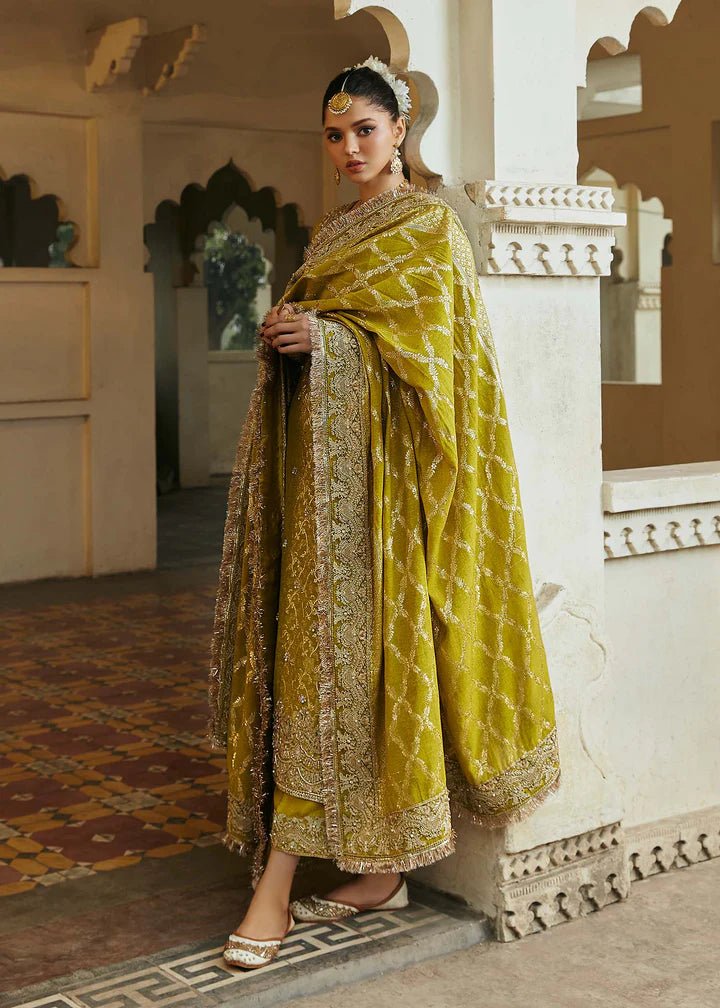 Model wearing mustard yellow Mushq dress from Kanwal Malik, Afsheen Luxury Pret 2024 collection. Pakistani clothes online in UK, wedding clothes.