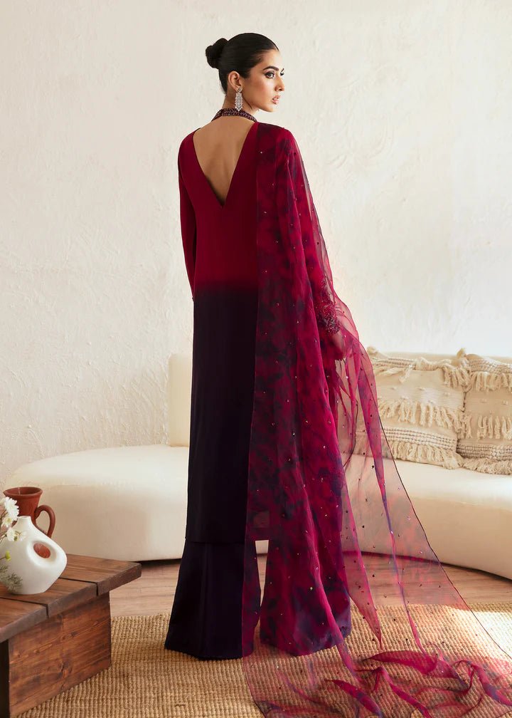 Model wearing a maroon and deep purple Aroha dress from Kanwal Malik's Amelie Luxury Pret collection. Ideal for wedding clothes and Pakistani clothes online in the UK.