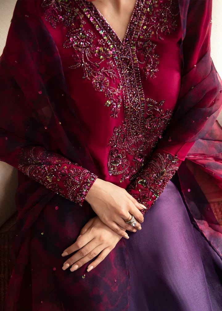 Model wearing a maroon and deep purple Aroha dress from Kanwal Malik's Amelie Luxury Pret collection. Ideal for wedding clothes and Pakistani clothes online in the UK.