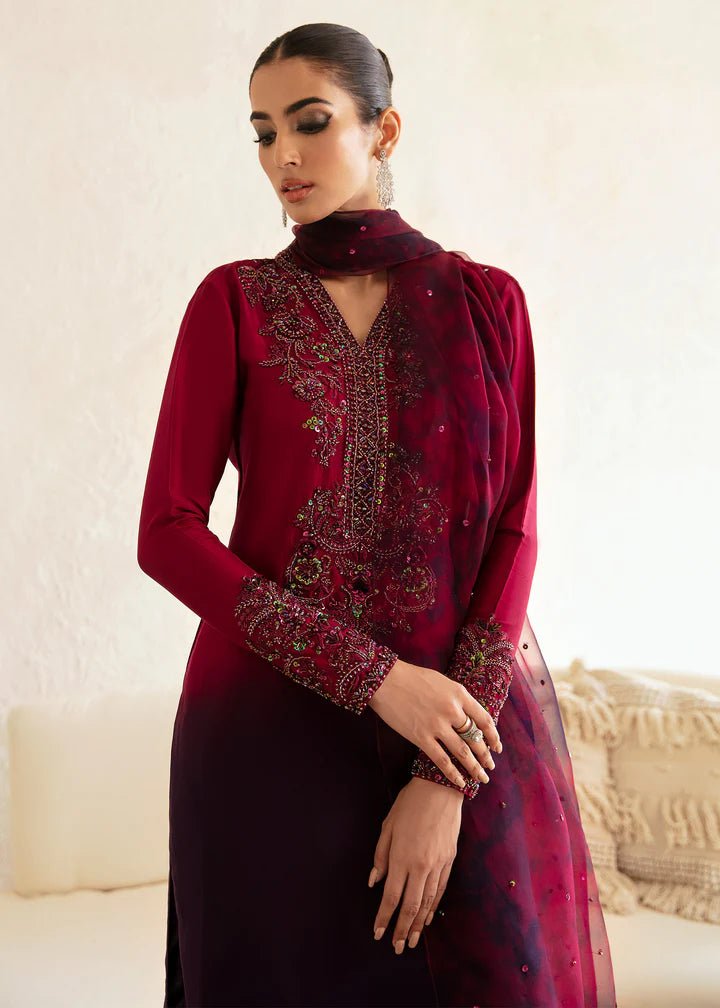 Model wearing a maroon and deep purple Aroha dress from Kanwal Malik's Amelie Luxury Pret collection. Ideal for wedding clothes and Pakistani clothes online in the UK.