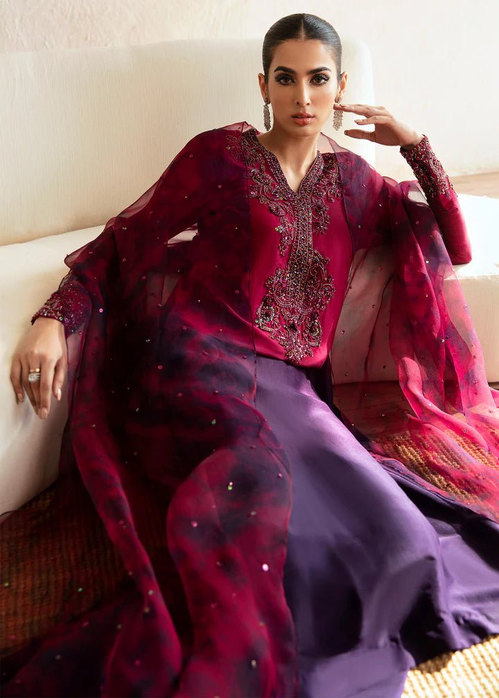 Model wearing a maroon and deep purple Aroha dress from Kanwal Malik's Amelie Luxury Pret collection. Ideal for wedding clothes and Pakistani clothes online in the UK.