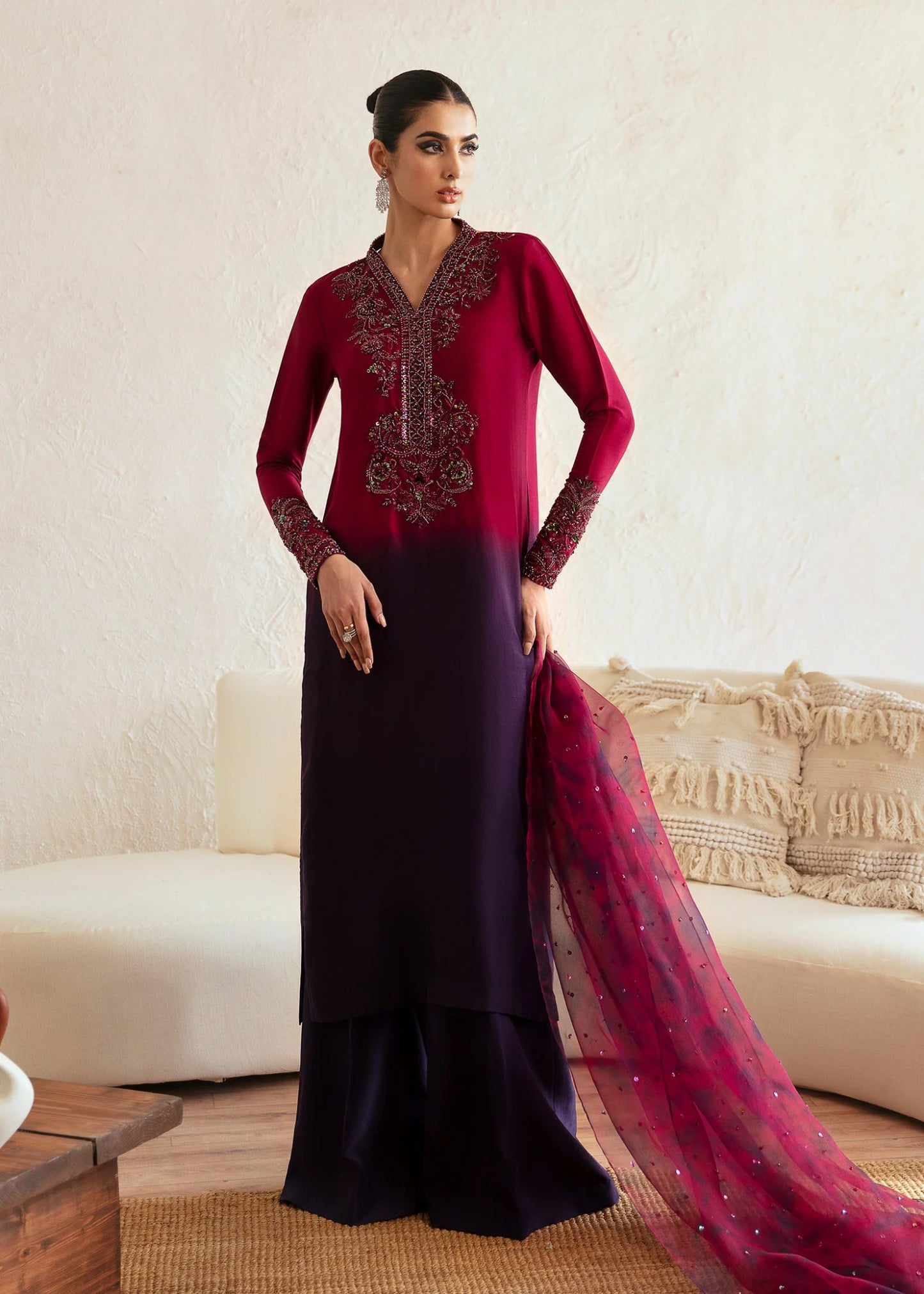 Model wearing a maroon and deep purple Aroha dress from Kanwal Malik's Amelie Luxury Pret collection. Ideal for wedding clothes and Pakistani clothes online in the UK.