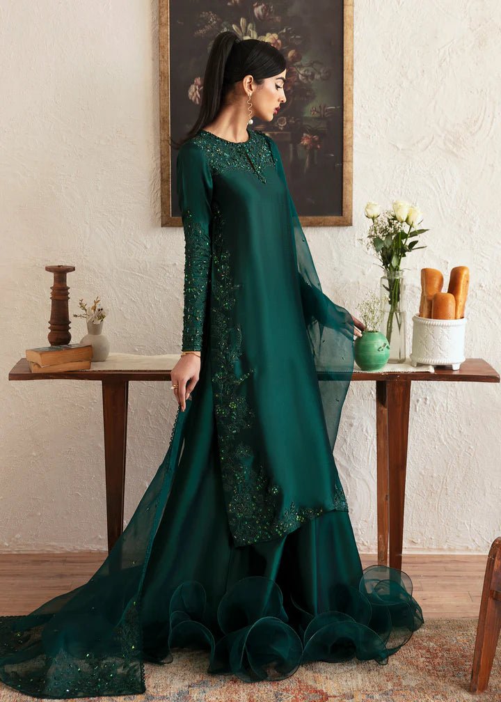 Model wearing an elegant dark green dress with intricate embroidery from Kanwal Malik's Amelie Luxury Pret collection. Perfect for weddings, Pakistani clothes online in UK.