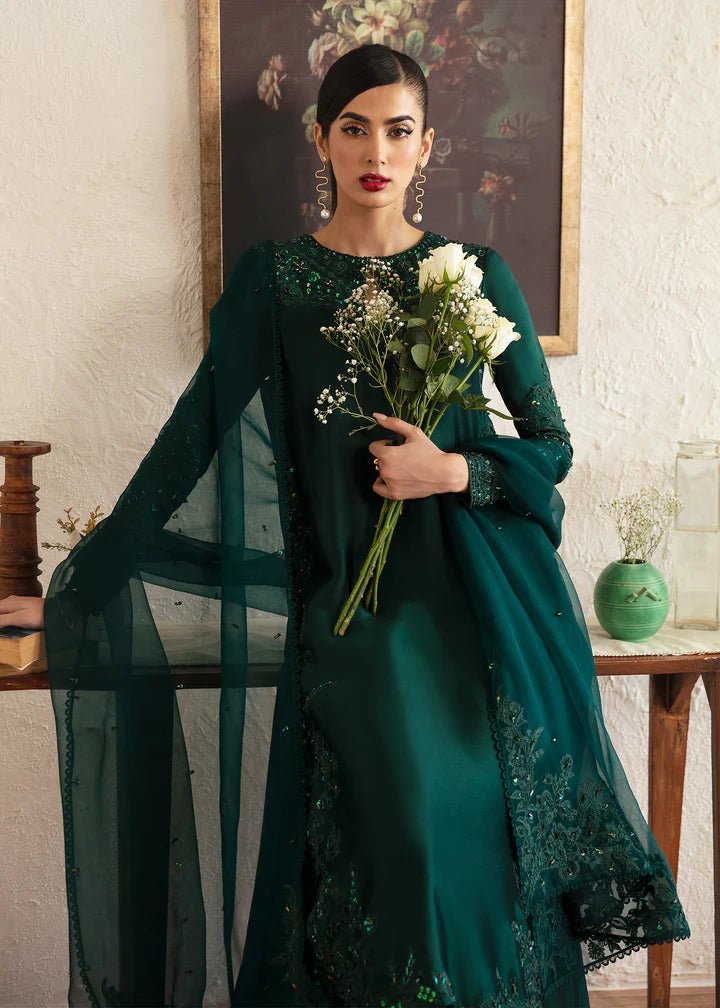 Model wearing an elegant dark green dress with intricate embroidery from Kanwal Malik's Amelie Luxury Pret collection. Perfect for weddings, Pakistani clothes online in UK.