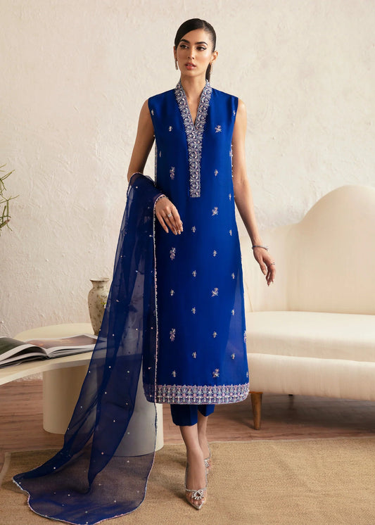 Model wearing blue Siya dress from Kanwal Malik. Featuring intricate embroidery and a matching dupatta, ideal for wedding and festive occasions. Perfect for those seeking Pakistani clothes online in the UK.