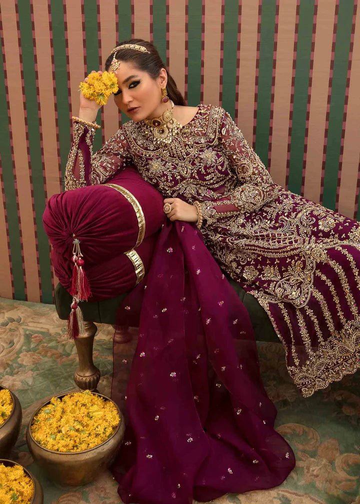 Model flaunting Kanwal Malik Angana '23 Anari dress, representing Pakistani wedding attire available online in the UK.