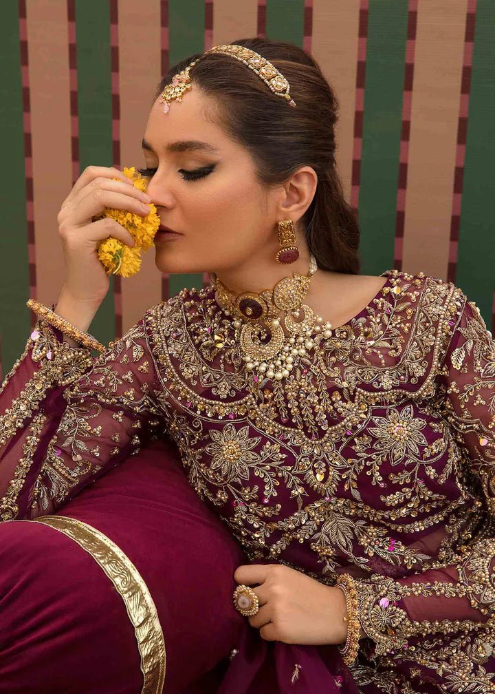 Model flaunting Kanwal Malik Angana '23 Anari dress, representing Pakistani wedding attire available online in the UK.