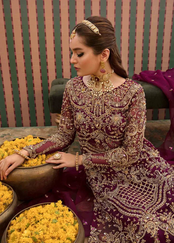 Model flaunting Kanwal Malik Angana '23 Anari dress, representing Pakistani wedding attire available online in the UK.