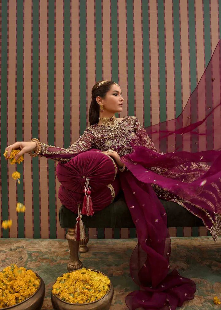 Model flaunting Kanwal Malik Angana '23 Anari dress, representing Pakistani wedding attire available online in the UK.