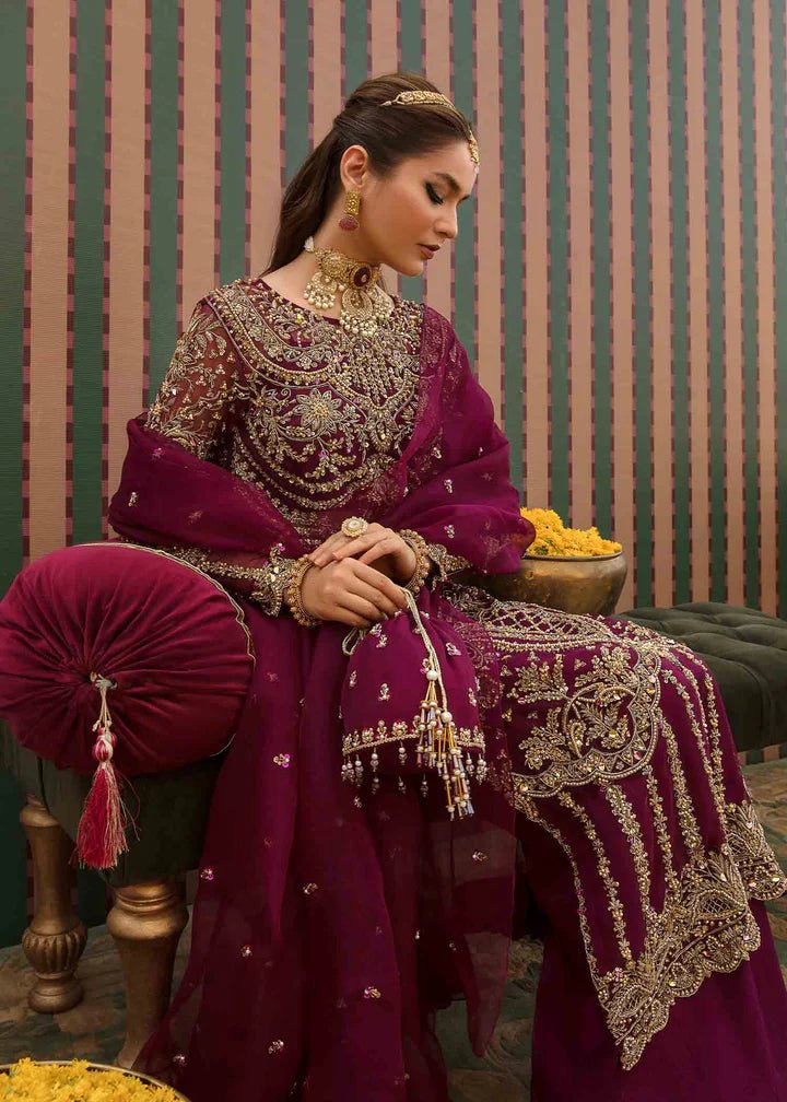 Model flaunting Kanwal Malik Angana '23 Anari dress, representing Pakistani wedding attire available online in the UK.