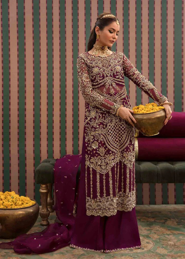 Model flaunting Kanwal Malik Angana '23 Anari dress, representing Pakistani wedding attire available online in the UK.