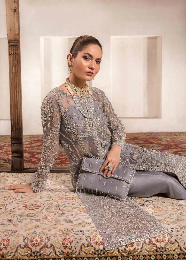 Model wearing Kanwal Malik Angana '23 Chandi dress, exquisite Pakistani wedding attire available online in the UK.