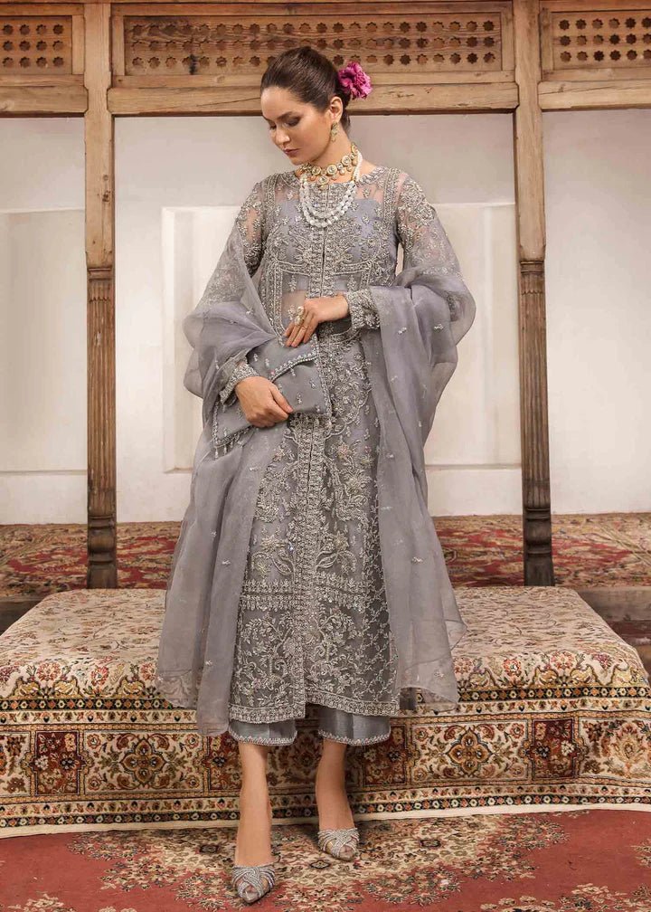 Model wearing Kanwal Malik Angana '23 Chandi dress, exquisite Pakistani wedding attire available online in the UK.