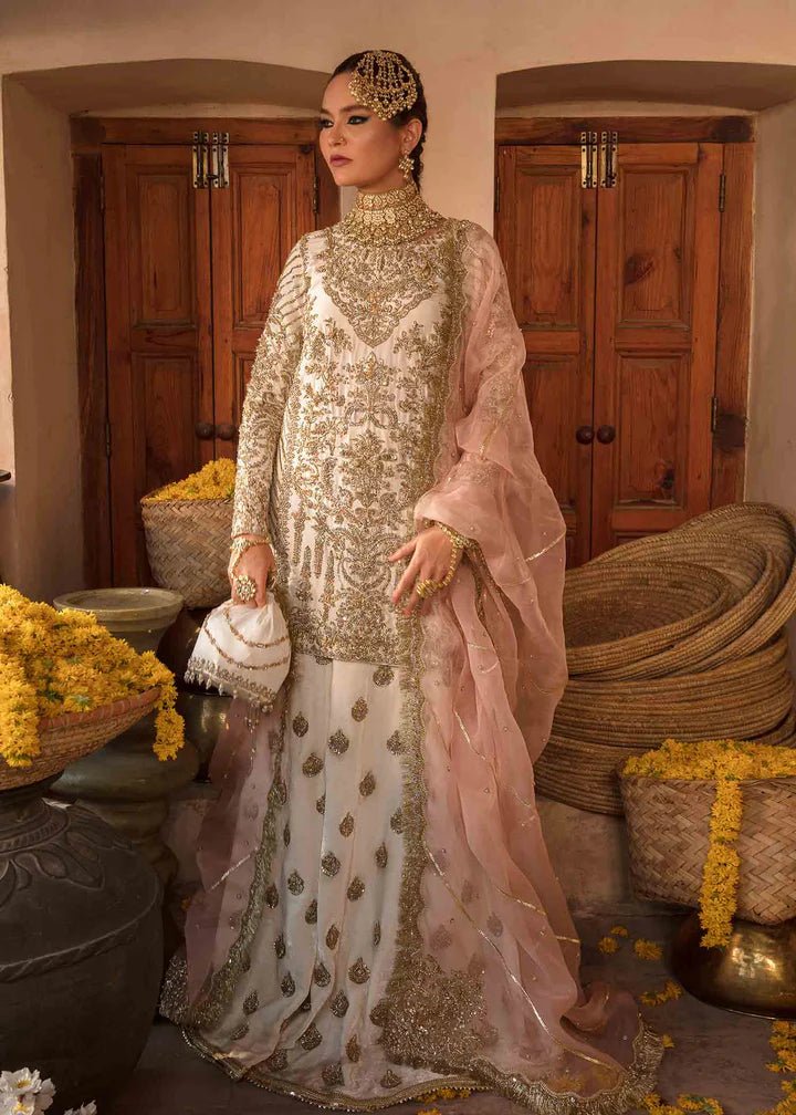 Model showcasing Kanwal Malik Angana '23 Nargis dress, epitomizing Pakistani wedding attire online in the UK.