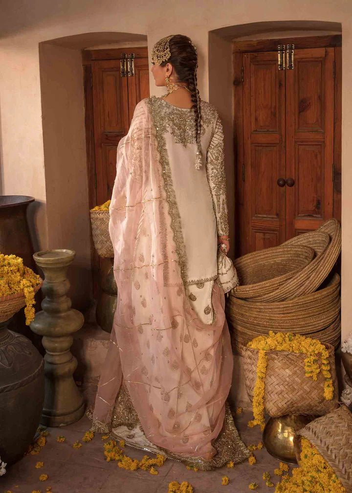 Model showcasing Kanwal Malik Angana '23 Nargis dress, epitomizing Pakistani wedding attire online in the UK.