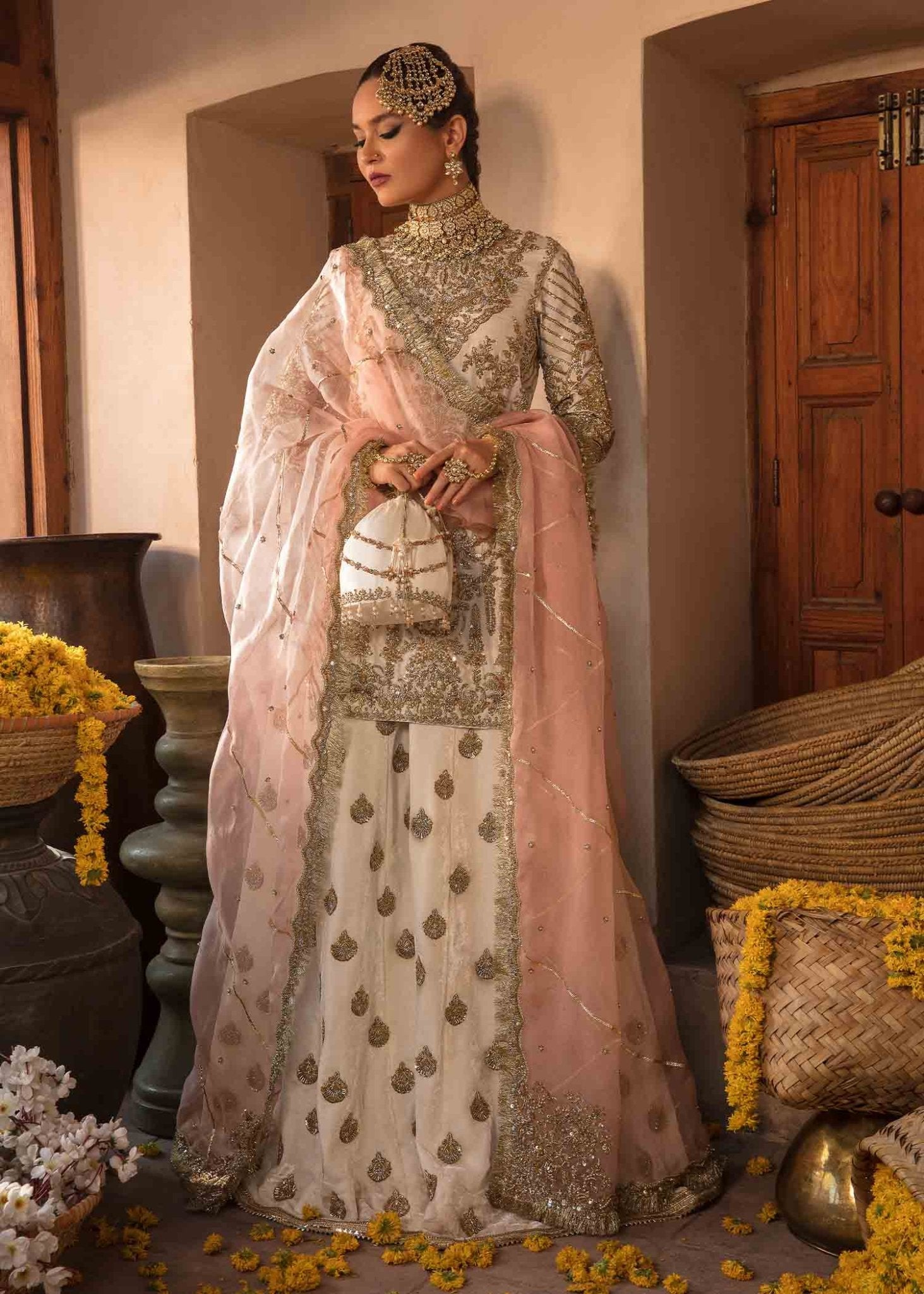 Model in 'Nargis' by Kanwal Malik UK, showcasing luxurious Pakistani clothes UK.