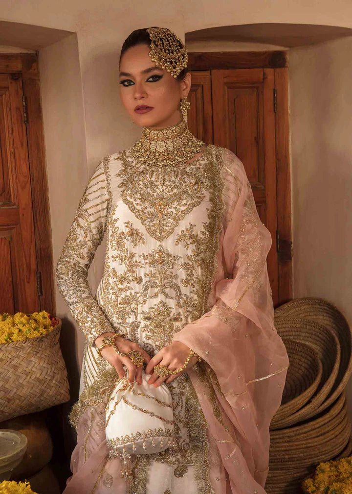 Model showcasing Kanwal Malik Angana '23 Nargis dress, epitomizing Pakistani wedding attire online in the UK.