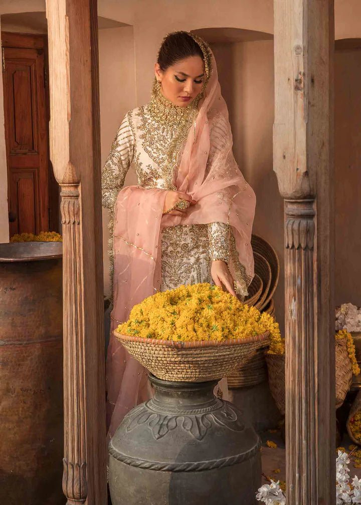 Model showcasing Kanwal Malik Angana '23 Nargis dress, epitomizing Pakistani wedding attire online in the UK.