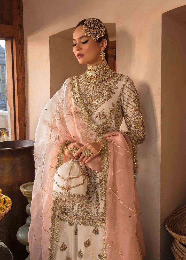 Model showcasing Kanwal Malik Angana '23 Nargis dress, epitomizing Pakistani wedding attire online in the UK.