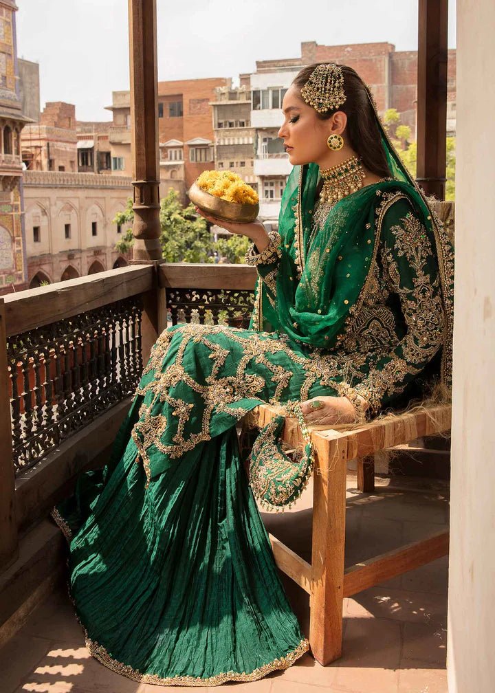 Model flaunting Kanwal Malik Angana '23 Zaytooni dress, showcasing Pakistani wedding attire online in the UK.