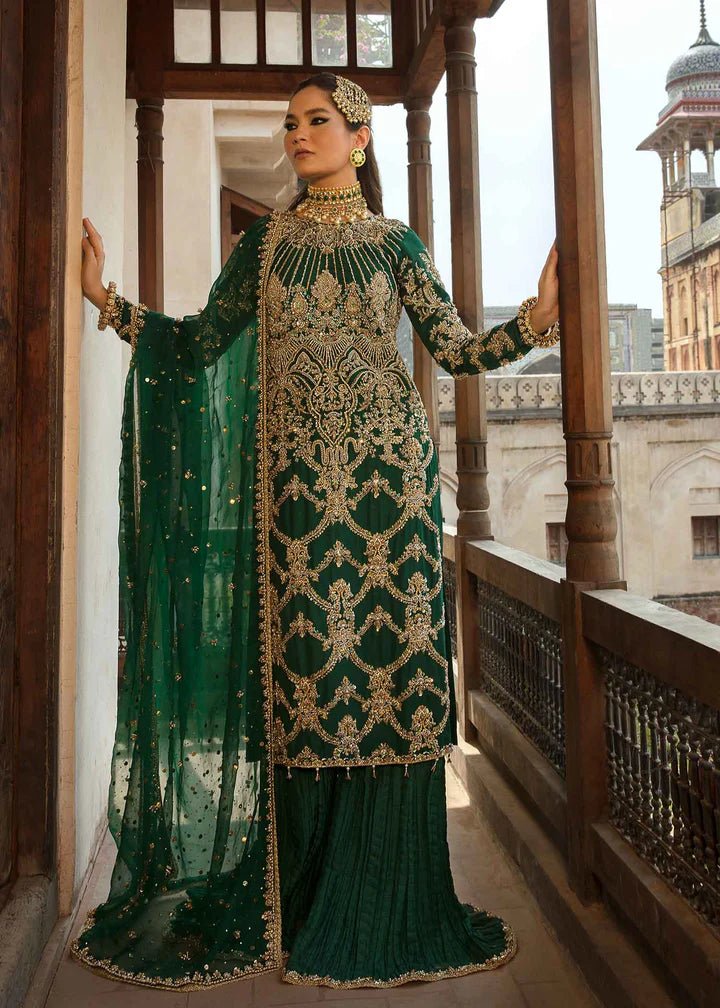 Model flaunting Kanwal Malik Angana '23 Zaytooni dress, showcasing Pakistani wedding attire online in the UK.