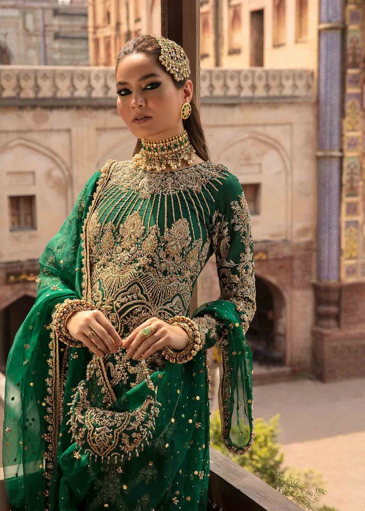 Model flaunting Kanwal Malik Angana '23 Zaytooni dress, showcasing Pakistani wedding attire online in the UK.