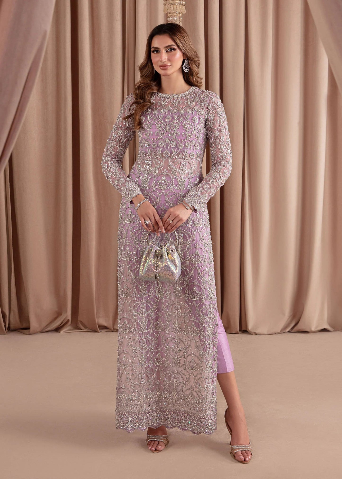 Model wearing Kanwal Malik Elara Luxury Pret '24 Eliza dress in lavender, showcasing Pakistani wedding clothes online in the UK.