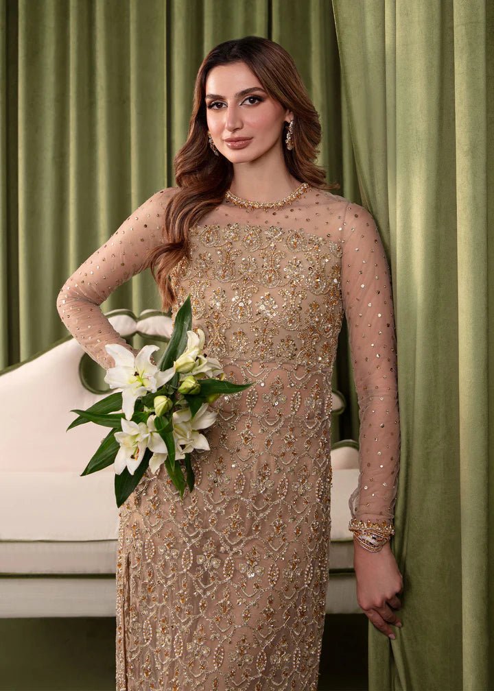 Model wearing Kanwal Malik Elara Luxury Pret '24 Gemma dress in gold, showcasing Pakistani wedding clothes online in the UK.