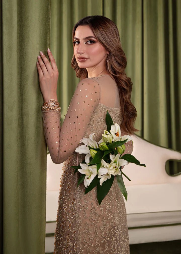 Model wearing Kanwal Malik Elara Luxury Pret '24 Gemma dress in gold, showcasing Pakistani wedding clothes online in the UK.