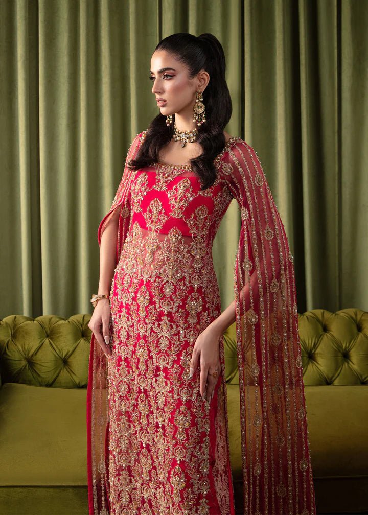 Model wearing Kanwal Malik Elara Luxury Pret '24 Mirage dress in red, showcasing Pakistani wedding clothes online in the UK.