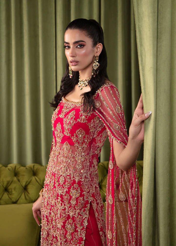 Model wearing Kanwal Malik Elara Luxury Pret '24 Mirage dress in red, showcasing Pakistani wedding clothes online in the UK.