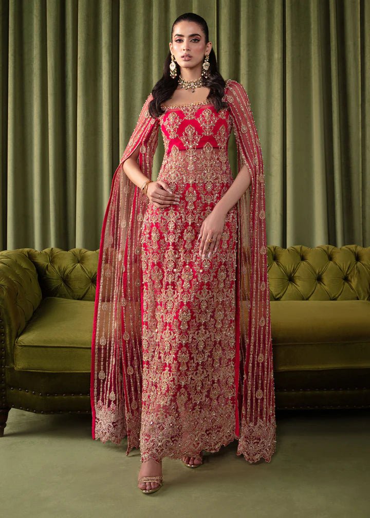 Model wearing Kanwal Malik Elara Luxury Pret '24 Mirage dress in red, showcasing Pakistani wedding clothes online in the UK.